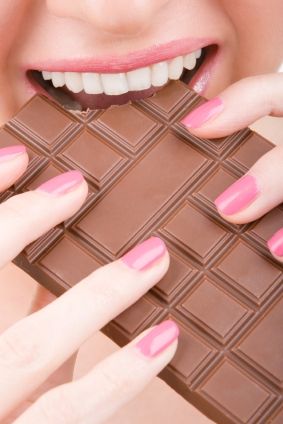 fun woman eating chocolate