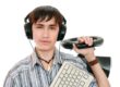 A boy with headphones on holding keyboard and joy stick