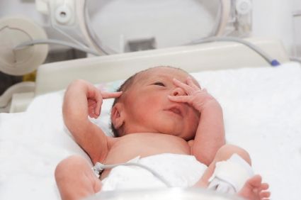 Newborn baby inside incubator