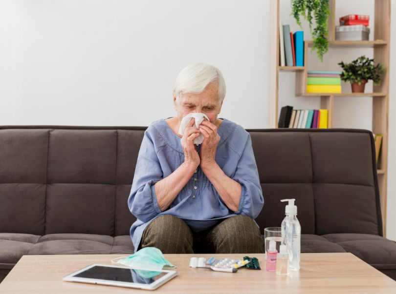 senior woman unable to prevent common cold is self-treating at home