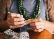 woman demonstrates how to reduce anxiety naturally through knitting