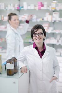 Young female pharmacist in an international pharmacy
