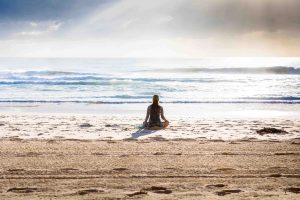 woman sitting outdoor and gaining benefits of vitamin d