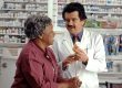 Senior woman discusses medicare part d with pharmacist
