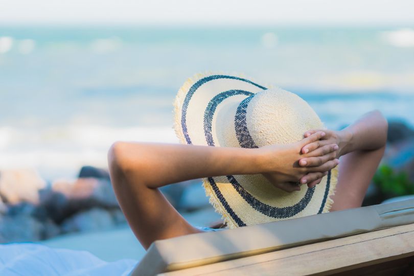 woman enjoying the sun after using Heliocare sunscreen pill