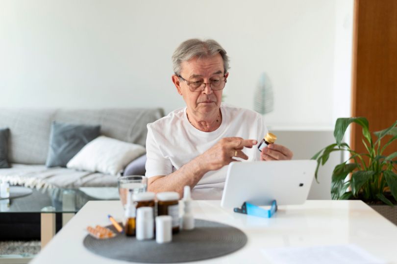 Senior man browsing a verified online pharmacy website