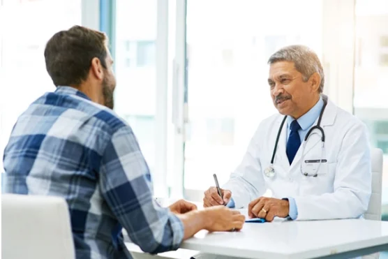A physician consulting a male patient about the Vioxx drug