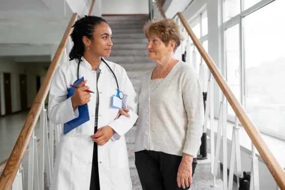 A doctor and a senior patient engaging in a conversation about their treatment plan, likely concerning Eliquis and pain medication considerations