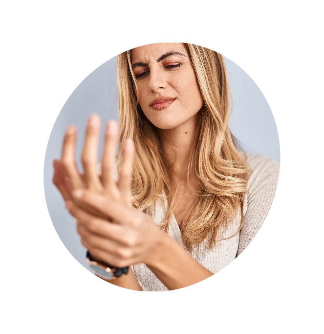 A lady holding her wrist in pain due to Gout
