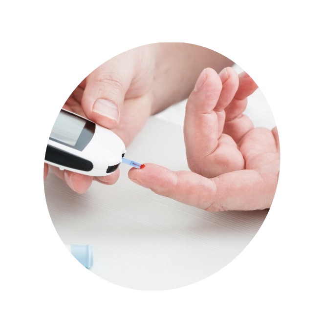 An individual with diabetes takes blood using a monitoring device.
