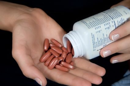 Close-up on Vitamin Pills being Poured in an Open Hand