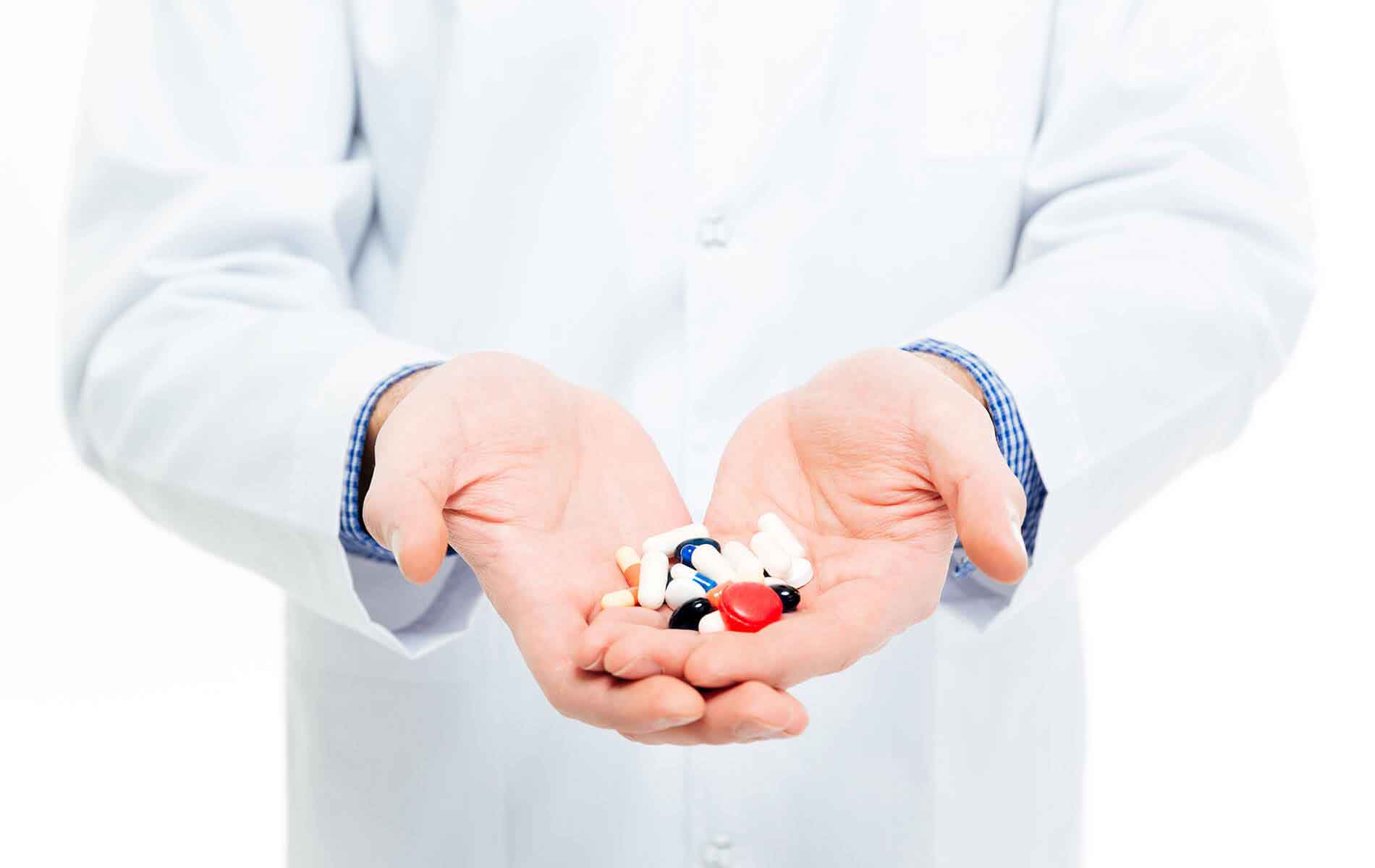 Pharmacists holding Drug's in his hand.
