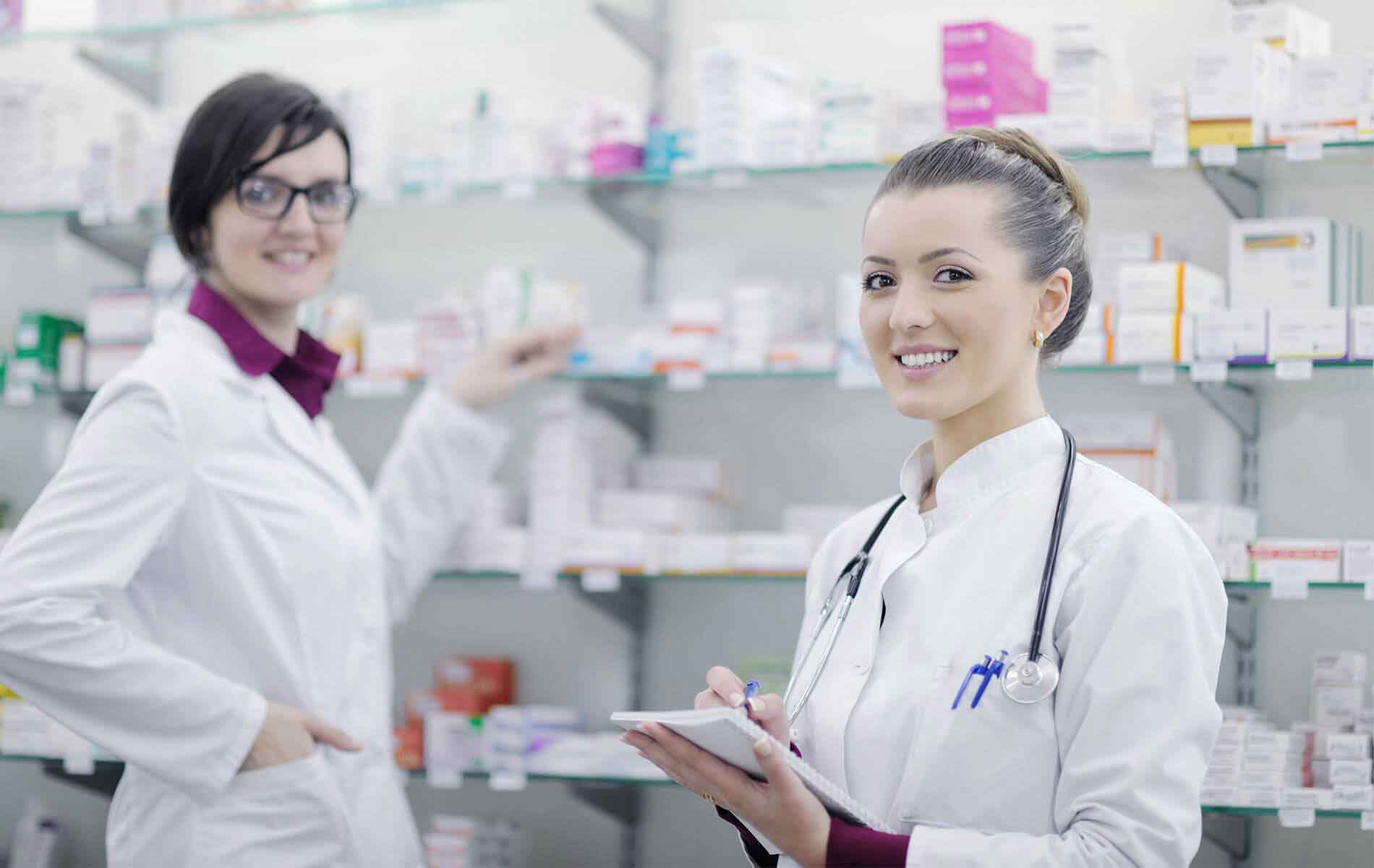 Young pharmacists and a doctor in a Pharmacy.